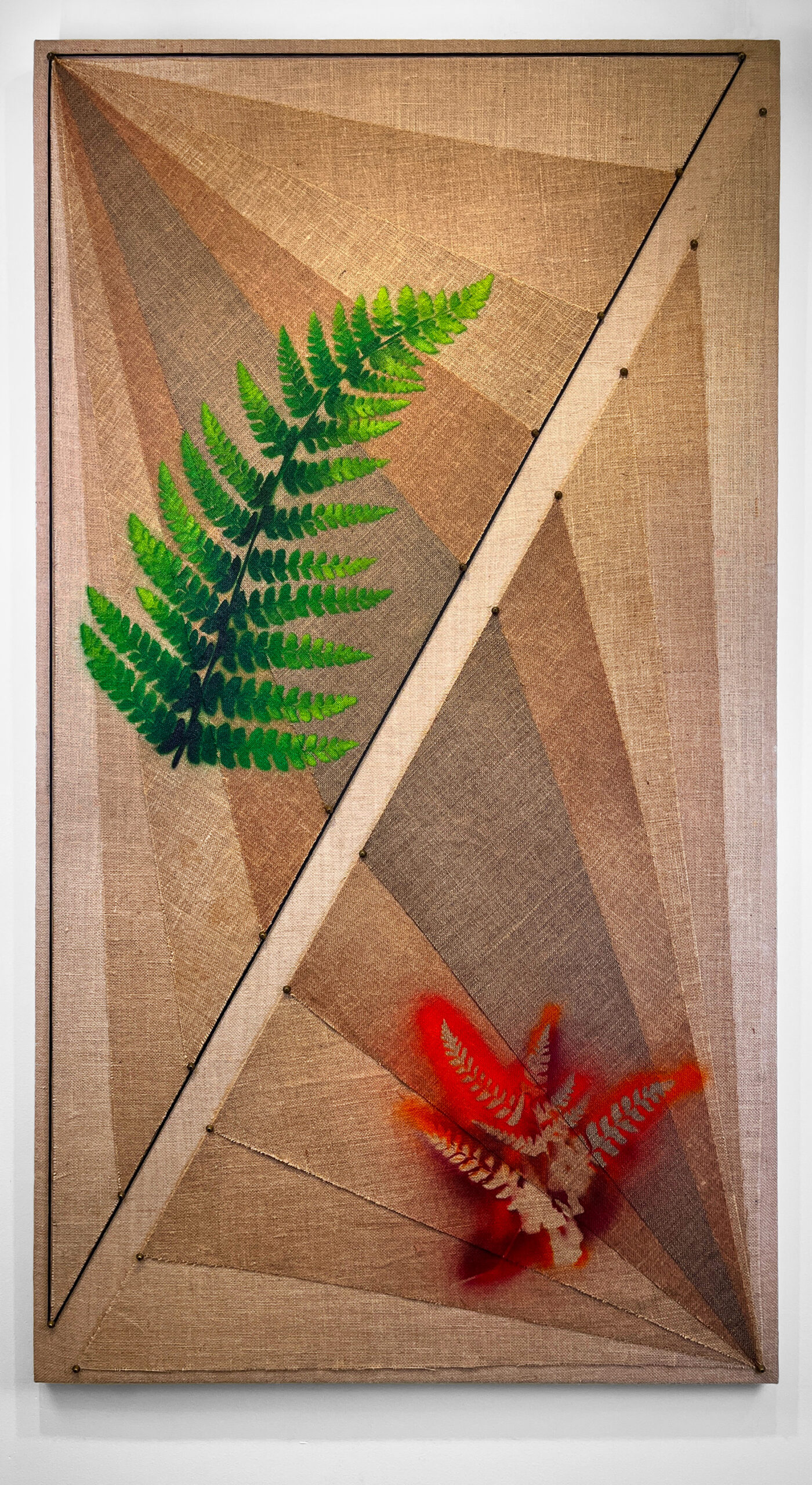 "Look and Feel," 2022, spray paint, wood stain, notions, paracord, burlap on panel, 72in. x 40in.